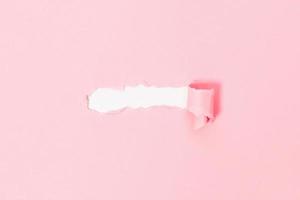 Top view of pink torn paper on white background. Free space for text banner photo