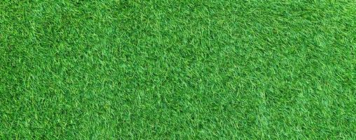 Panorama of green artificial turf flooring texture and background seamless photo