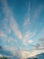 Feather clouds in the shape of an angel are visible in the sky. The photo was taken on the day of the Archangel Michael