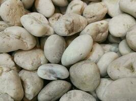 muchas piedras pequeñas para la decoración de la belleza. foto