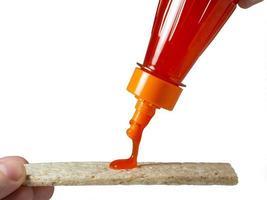 A loaf of bread is poured with a spicy sauce. Seasoning for food photo