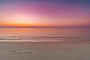 Colorful sky ocean beach sunrise with dramatic motivational mood. Tropical island seaside, coastal landscape, exotic beach shore, sea horizon. Inspire happy closeup of sand, beautiful summer travel photo