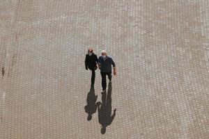 couple walking around on the street in bilbao city, basque country, spain, travel destinations photo