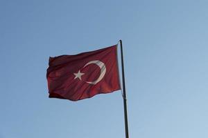 Turkish flag in blue sky background photo