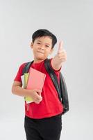 Successful school giving thumb up isolated on white background photo