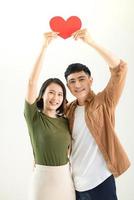 Bright picture of beautiful couple holding big heart photo