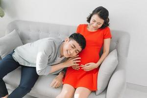 young pregnant woman with her husband expecting the baby photo