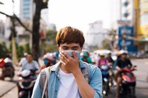 Asian man outside on the road with mask face. photo