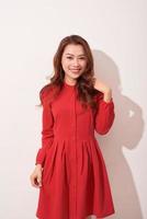 Beautiful female model posing in red clothes photo