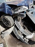 damaged hoods of cars during road accident photo