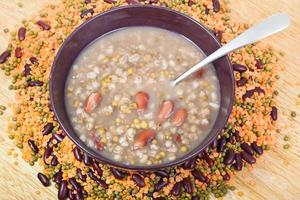top view of mess of pottage in bowl with tablespoon photo