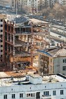 demolition of old house on urban street photo