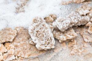 crystalline salt on beach of Dead Sea photo