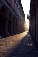 Via Zamboni in University district of Bologna at sunset photo