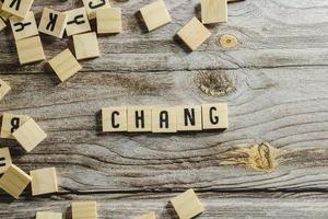 Change word cube on wood background ,English language learning concept photo