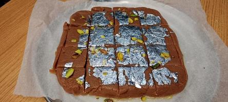 Biscuit Sweet Recipe, Indian Sweet Food making from Biscuit, Biscuit Mithai, Milk Barfi in Wooden Background photo