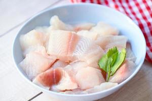 fresh raw pangasius fish fillet with, meat dolly fish tilapia striped catfish, fish fillet on bowl for cooking photo