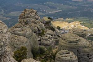 Mountain canyon, gray limestone cliffs in the form of pillars formed under the action of natural forces. photo