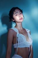 Attractive young wet hair Asian woman model with perfect fresh skin on underwater simulation of lighting Face care Facial treatment Cosmetology Plastic Surgery Lovely girl portrait in studio photo