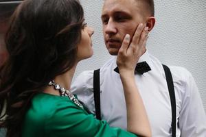 man and woman is hidden from view behind a trailer photo