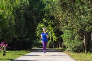 young female runner training for marathon photo