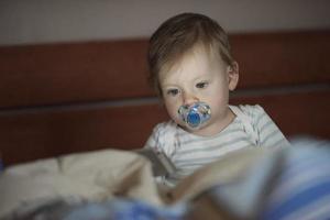 cute  little  baby playing and making first steps photo