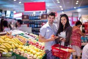 couple shopping in a supermarket photo