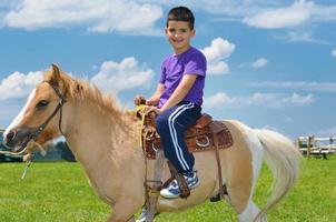 child ride pony photo