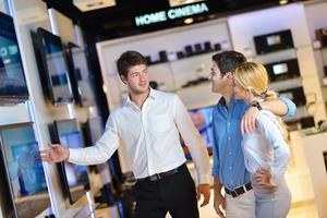 People in electronics store photo