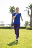young female runner training for marathon photo