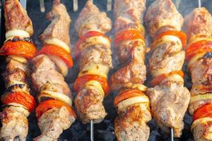 Grilled fried pork meat, pieces of meat on skewers. photo