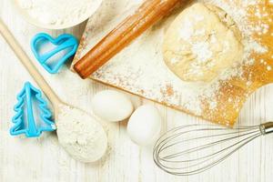 Baking ingredients on white wooden background photo