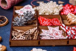 Christmas composition with gingerbread cookies, Christmas toys, pine cones and spices photo