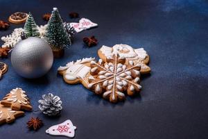 Christmas composition with gingerbread cookies, Christmas toys, pine cones and spices photo