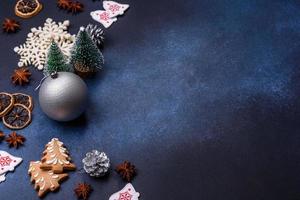 Christmas composition with gingerbread cookies, Christmas toys, pine cones and spices photo