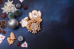 Christmas composition with gingerbread cookies, Christmas toys, pine cones and spices photo