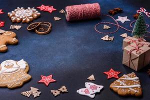 Christmas composition with gingerbread cookies, Christmas toys, pine cones and spices photo