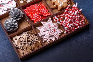 Christmas composition with gingerbread cookies, Christmas toys, pine cones and spices photo
