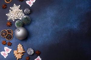 Christmas composition with gingerbread cookies, Christmas toys, pine cones and spices photo