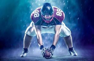 American football player starting football game photo