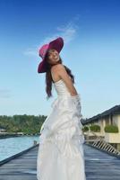 asian bride on beach photo