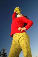 happy girl with grape outside photo