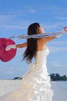 asian bride on beach photo