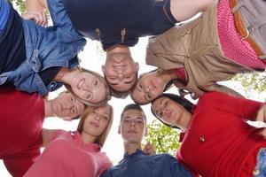 young friends staying together outdoor in the park photo