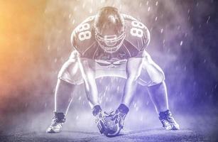 American football player starting football game photo