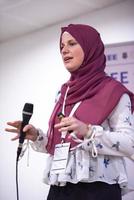 Muslim businesswoman giving presentations at conference room photo