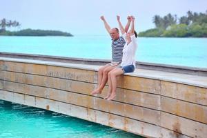 happy young couple have fun on beach photo