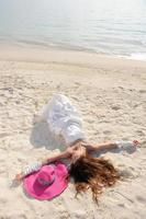 asian bride on beach photo