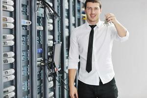 young it engeneer in datacenter server room photo