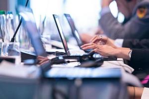 close up of business people hands using laptop computer photo